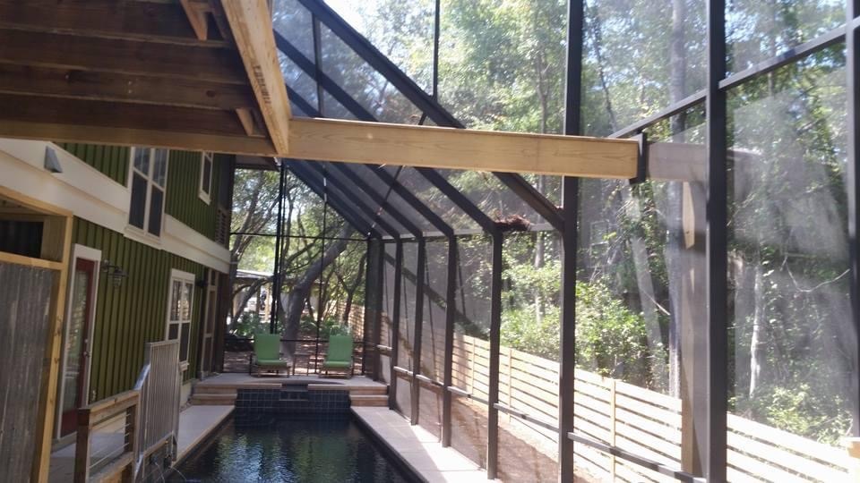 Aluminum screen enclosure around a swimming pool from the CoverWorks project gallery