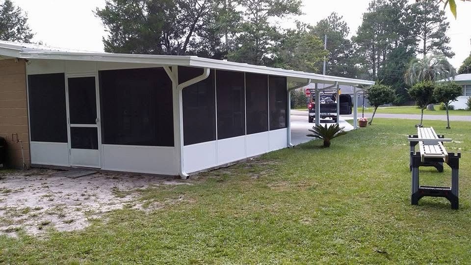 White aluminum screen room with a door, solid lower panels and adjoining patio cover