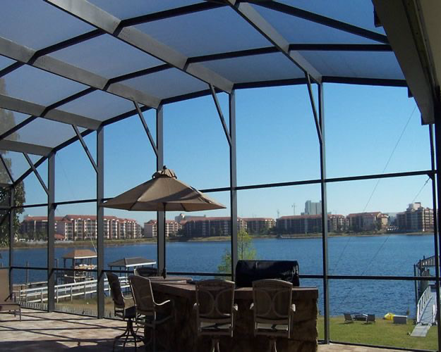 Aluminum screen enclosure with tall panels overlooking a waterfront